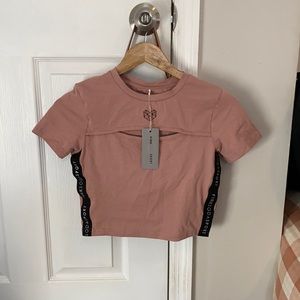 pink soda sport shirt with cut out on neck line